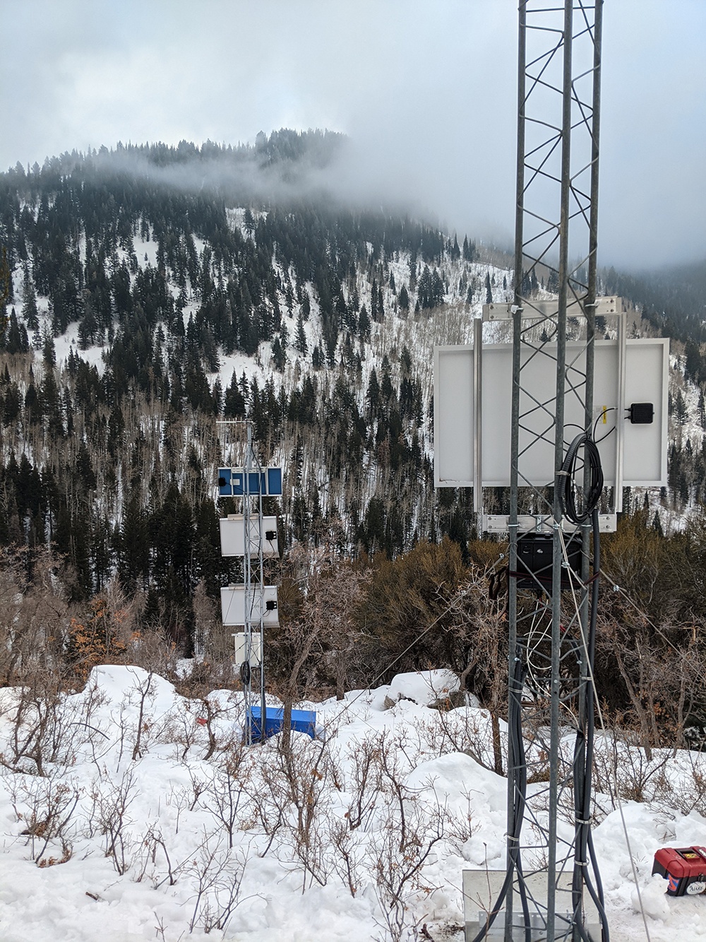 Avalanche monitoring equipment set up in the backcountry.
